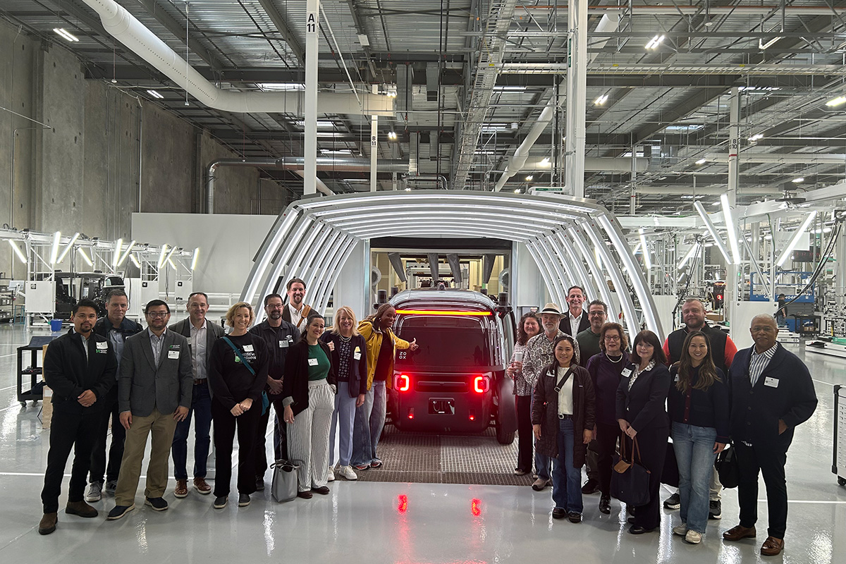 Members tour the Zoox robotaxi production facility in Hayward